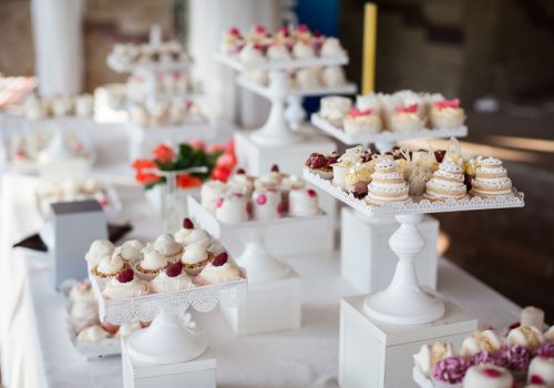bigstock-Wedding-Reception-Dessert-Tabl-115415384.jpg
